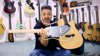 How Does The Hush-i Pro Travel Guitar Compare To A Regular Donner Dag-1c Acoustic Guitar?